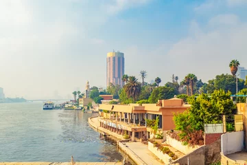 Fotobehang Foggy morning in Cairo. View of the Nile from the bridge. © lizavetta