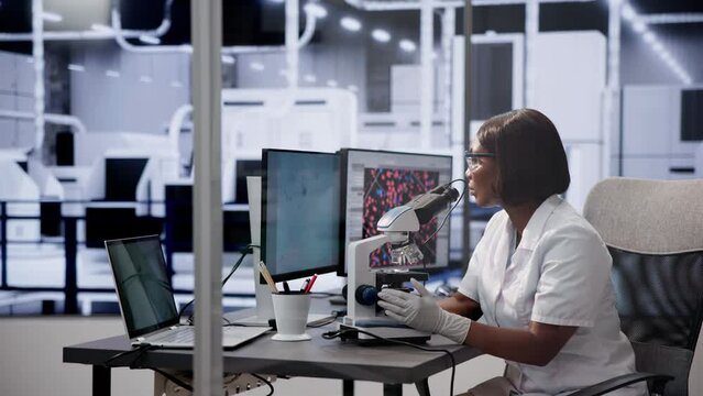 Female black girl using DNA monitor