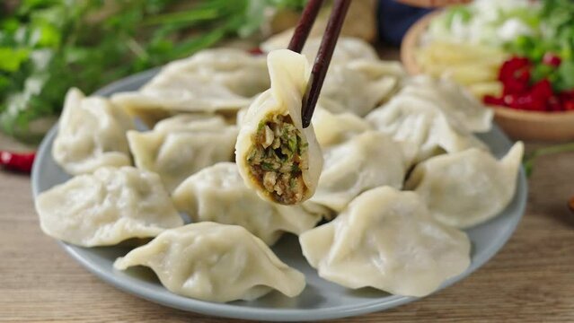 Close up fresh boiled dumplings . traditional food on rustic old wooden background.