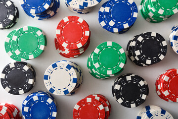 Background with pattern of stacks of colorful chips top view