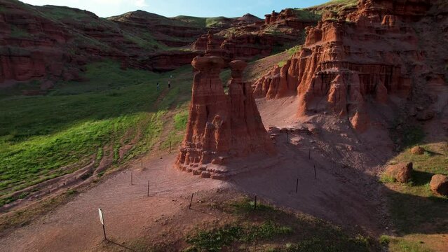 erzurum narman fairy chimneys green grass on red soil aerial view 4K