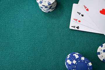 Card game table background with four uncovered aces and chips