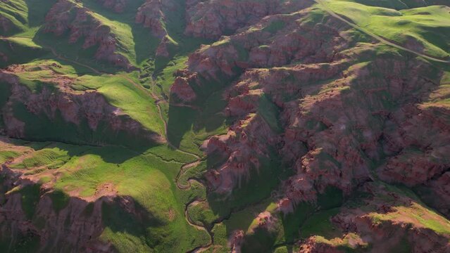 erzurum narman fairy chimneys green grass on red soil aerial view 4K