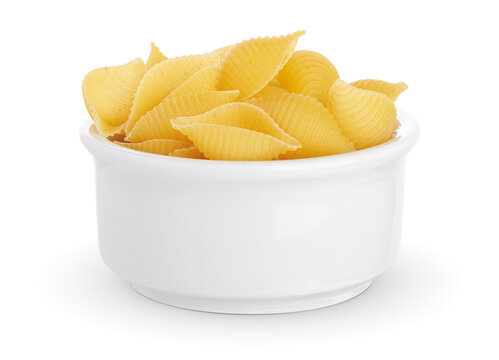 Conchiglie rigate. Raw stripped shell pasta isolated on white background. Italian traditional cuisine. Ucooked ingredient