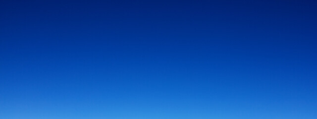 Blue gradient cold sky in the Alps