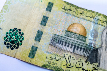 A fifty riyals Saudi bank note isolated in white.