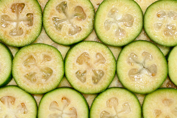 Background of slices tropical fruit feijoa. Top view.
