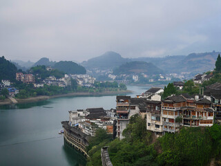 Fototapeta na wymiar Scenery of the river and old buildings of Furongzhen, China