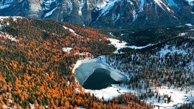 Aerial Drone View of Malghette's Lake in front of Brenta Dolomites at Fall - Graded