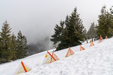 A dangerous ski slope is marked with a red warning sign. Karpacz, Poland