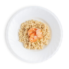 Top view of creamy homemade italian traditional risotto dish made of arborio rice boiled with broth decorated with fried shrimps or prawns and cheese served on plate isolated on white background