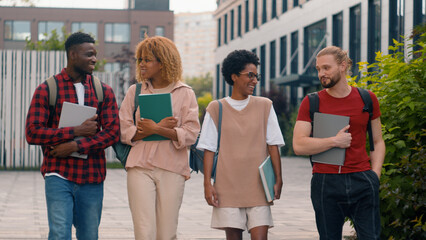 Diverse multiracial students boys girls talk walk in city education multiethnic friends happy talking conversation communicate walking college classmates group smiling together university friendship