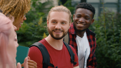 Closeup speaking smiling laughing five gen z diverse multiracial students boys girls talk walk outdoors multiethnic friends happy talking conversation communicate walking college university friendship