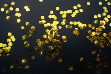 Golden festive circles festival on a black background. View from above. Christmas and  New Year concept
