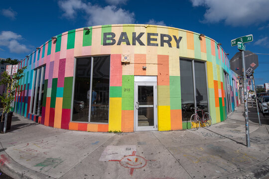 Miami, FL—Nov 20, 2023; Zak the Baker, bakery business painted in bright colors in Wynwood art district known for street, pop and graffiti art downtown that has revitalized the neighborhood.