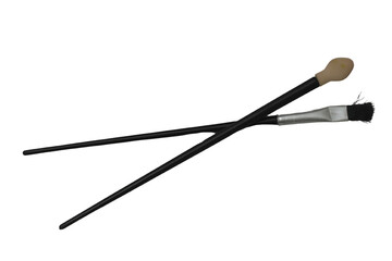 pair fine tip makeup brushes isolated on a white background.png