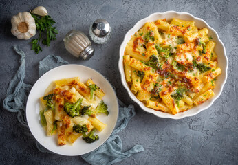 Pasta baked with broccoli and chicken. Broccoli, cheese and gratin sauce on baked penne pasta.