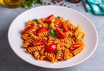 Fusilli pasta, spiral or spirali pasta with tomato sauce - Italian food style