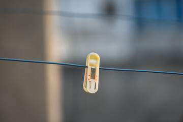 Selective focused view of close pin on wire for drying clothes