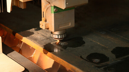 The process of cutting parts from a sheet of metal using a CNC machine. Creative. Metal laser cutting technology.