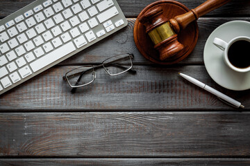 Lawyer desktop with Judge gavel and coffee cup