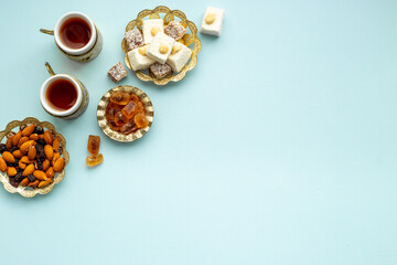 Arab style tea table with tea and sweets. Muslim holiday background