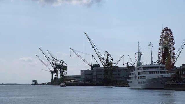 Cranes on embankment in the port city of Kobe, Japan.