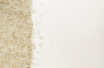 Background Raw basmati rice. Concept of Water-Conserving Products. Saving water. When growing rice, 10-20% of water is consumed. Horizontal orientation. Top view. Copy space