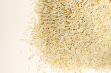 A heap of raw basmati rice. Concept of Water-Conserving Products. Saving water. When growing rice, 10-20% of water is consumed. Horizontal orientation. Top view. Copy space.
