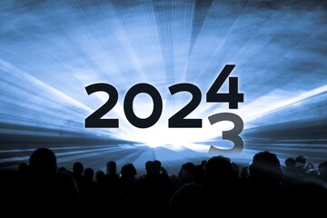 Turn of the year 2023 2024 blue laser show party. Luxury entertainment with people crowd audience silhouettes at new year celebration. Premium nightlife event at holidays season time - 683375558