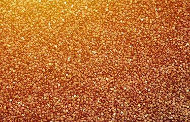 Background texture of a large pile of buckwheat. Many buckwheat grains close-up in daylight - Powered by Adobe