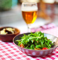 One glass of light beer with salad