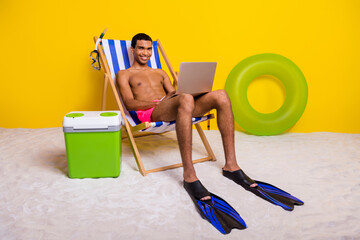 Full length photo of cool cheerful shirtless man relaxing lounge chair chatting twitter telegram...