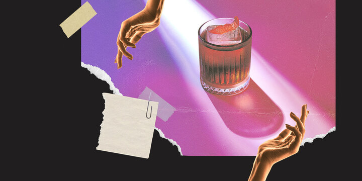 Negron cocktail. Human hands over glass with delicious strong drink, alcohol drink over abstract background. Creative colorful design.