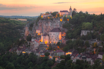 Colourful sunset or sunrise view of the French medieval hilltop village of Rocamadour, France in the Dordogne Valley. - Powered by Adobe