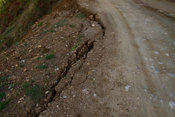 Landslide right at the edge of the road. Cracked Ground