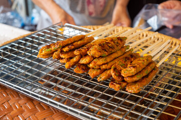 Seasoned Minced Fish with Aromatic Herb Skewer on a Grill