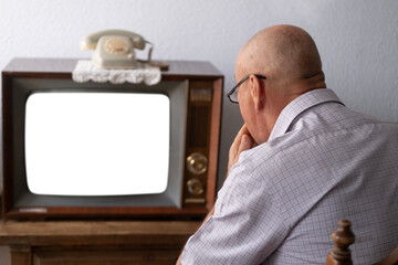 senior, man watching television, old tube vintage 60s TV, mockup on empty white screen, Online...