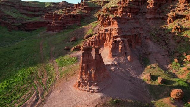 erzurum narman fairy chimneys green grass on red soil aerial view 4K