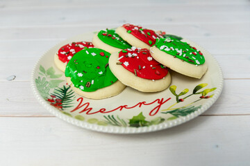 Colorful Christmas cookies on a Merry Christmas plate.