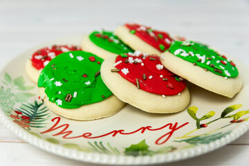 Colorful Christmas cookies on a Merry Christmas plate.