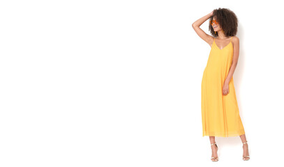 Beauty african american female in yellow dress on isolated white background.