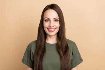 Portrait of young pretty woman young age office manager in khaki casual t shirt smile for social medias isolated on beige color background