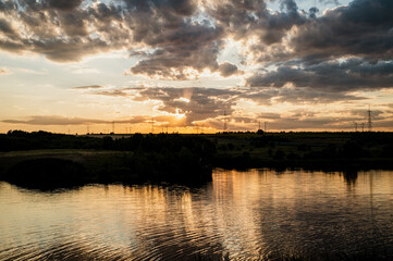 beautiful sunset on the river with banks piers