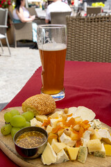 Drinks and snack board with different kind of cheece and fruit in Krakow in Malopolska region in Poland