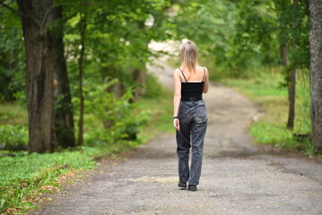 Young woman walking in a country park