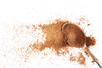 Milled nutmeg powder and spoon isolated on white, top view