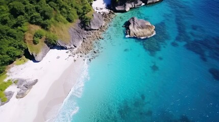 View from above of sandy beach with blue sea