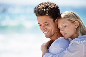 Happy, couple and hug by the beach on travel, vacation and trip date with a smile and embrace. Romance, summer and holiday by the sea and ocean with young people together on a break in Miami outdoor