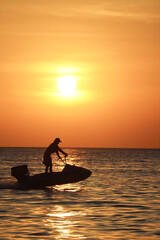 Riding a boat on the sea during sunset